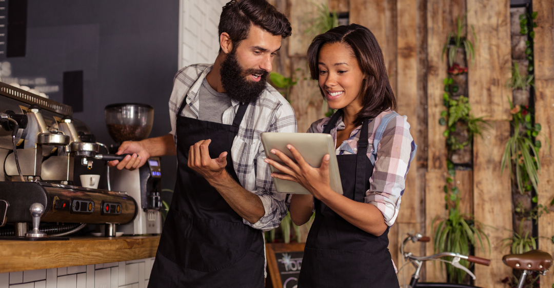 male and female restaurant server taking order on tablet like API works